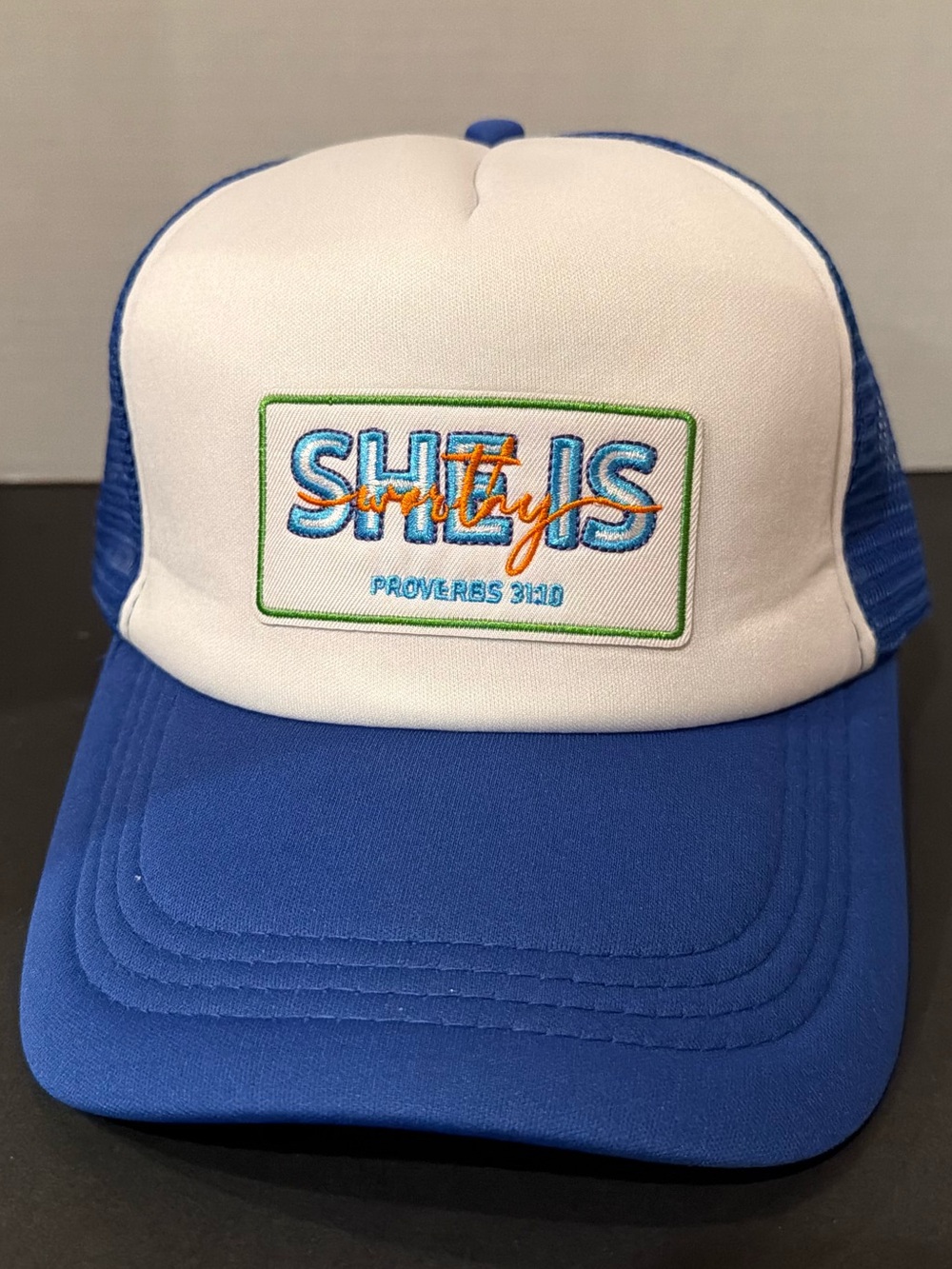 Blue and White Trucker Hat with Embroidered Logo “she is worthy”